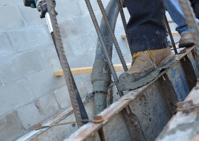 a worker works on a concrete block