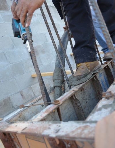 a worker works on a concrete block