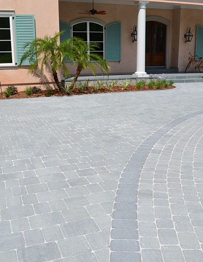 curved driveway and patio area outside of a building
