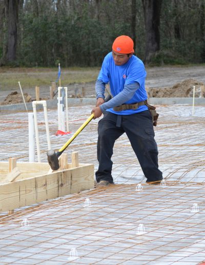 a worker with a sledge hammer