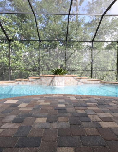 pool deck and raised waterfall feature