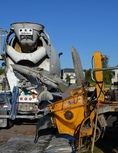 a concrete truck pours concrete