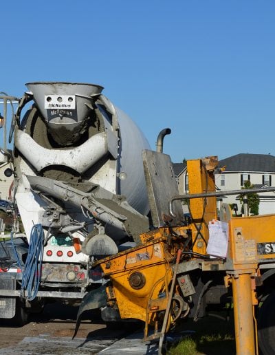 a concrete truck pours concrete