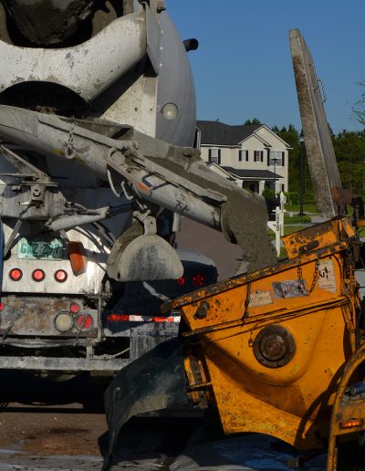 a concrete truck pours concrete