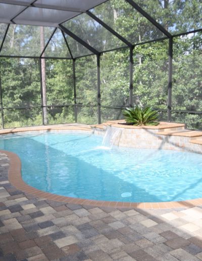 pool with sheer descent water feature and surrounding deck built by Walker Footings