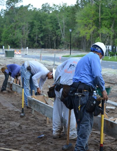 several workers working with concrete