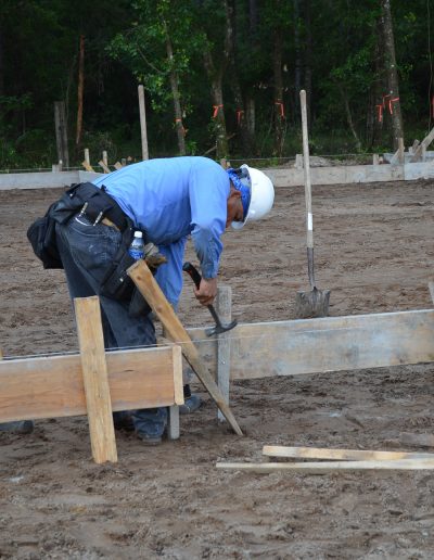 worker swinging hammer